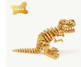 Gold dinosaur skeleton toy on a white background