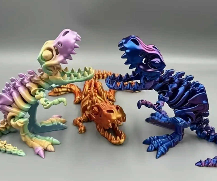 Three colorful dinosaur toy skeletons on a gray background
