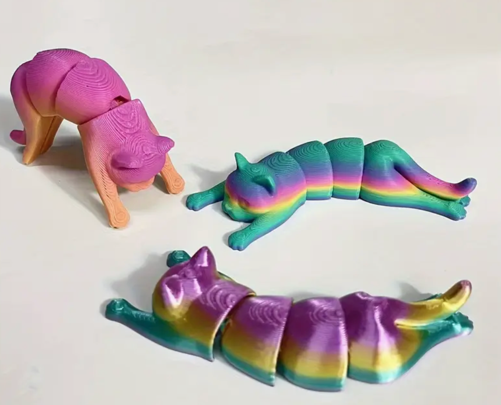 A 3.5" 3D-printed cat figurine in pastel tie-dye colors, featuring a smooth finish and charming design.