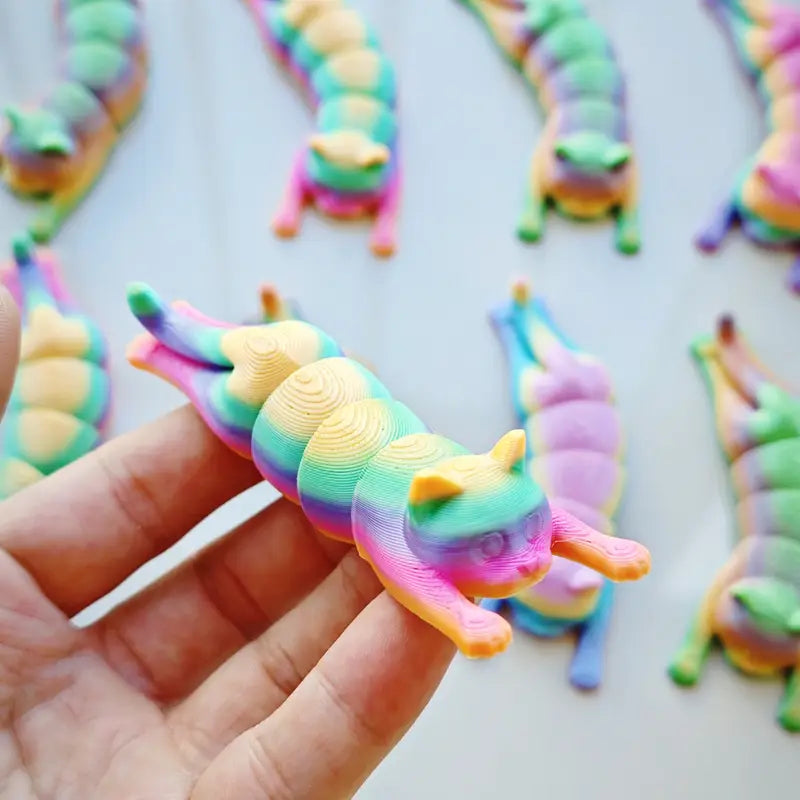 A 3.5" 3D-printed cat figurine in pastel tie-dye colors, featuring a smooth finish and charming design.