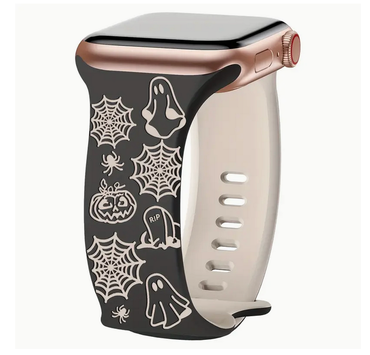 Smartwatch with a black band featuring Halloween-themed designs on a white background