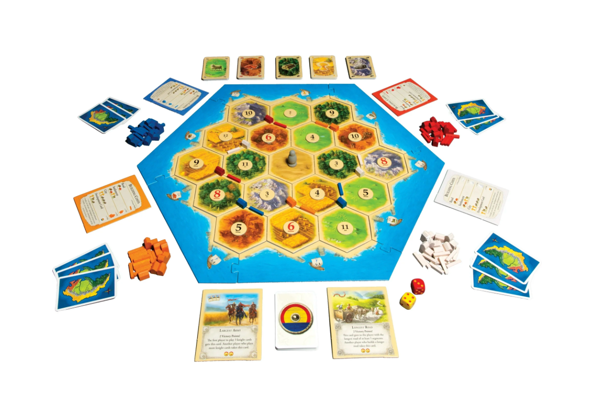 Board game with colorful hexagonal tiles and cards on a white background
