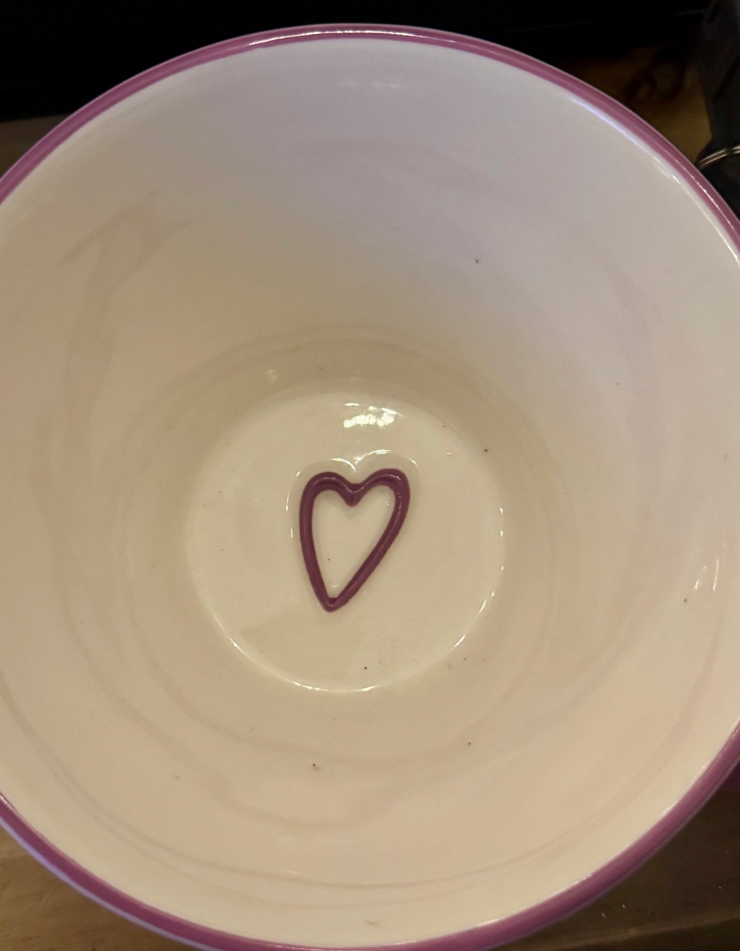 Lavender ceramic mug with a purple heart at the bottom inside