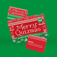 Red and green 'Merry Quizmas' cards on a green background