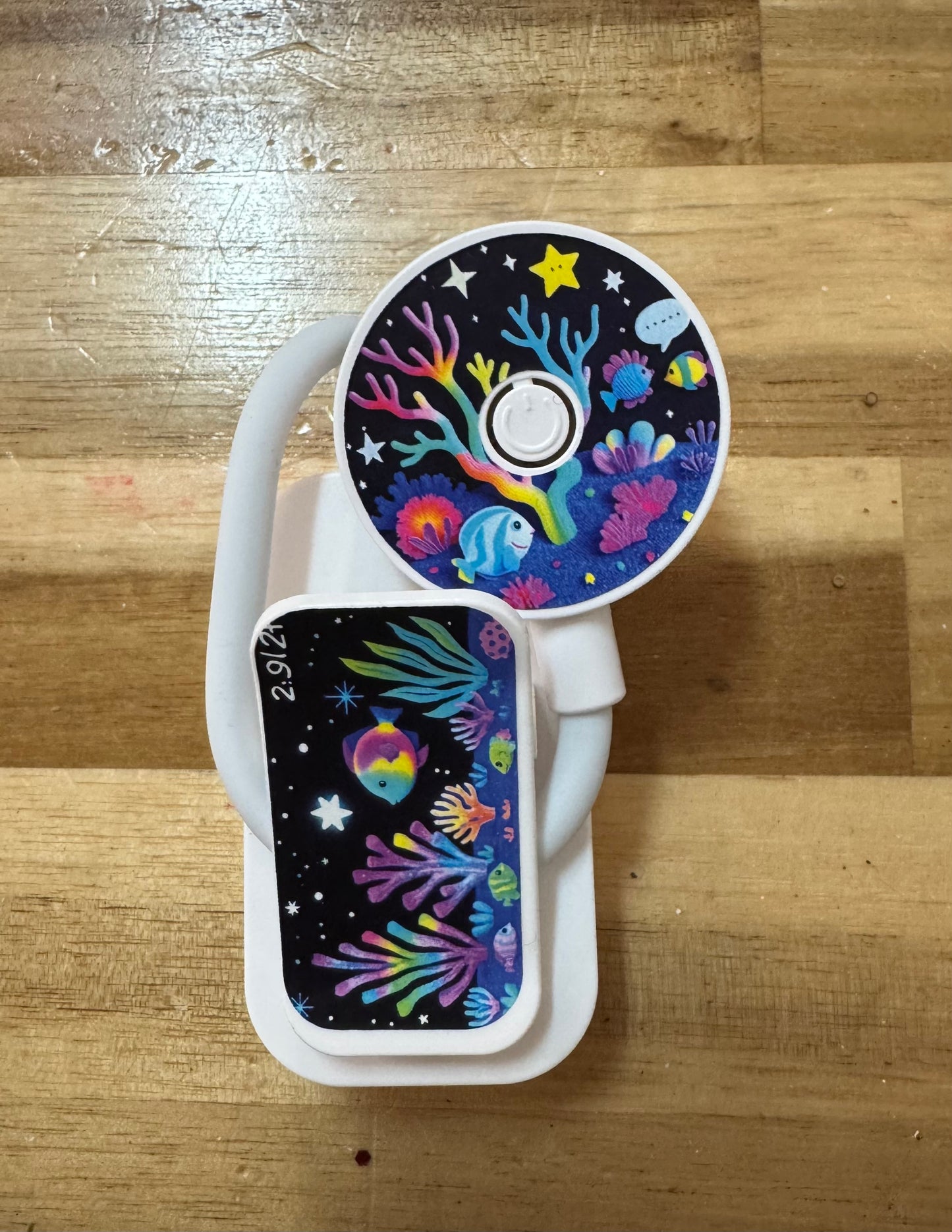 Colorful book light with ocean-themed design on a wooden surface