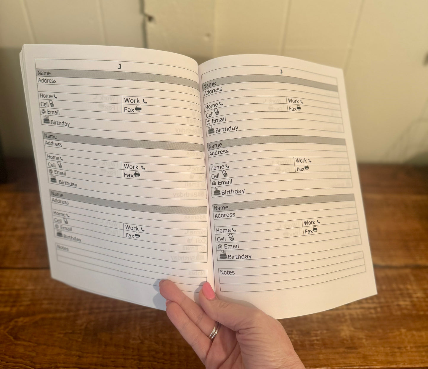 Floral-covered notebook with labeled sections for storing passwords, addresses, and birthdays—both practical and pretty.