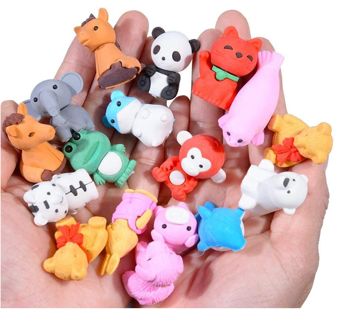 Colorful assortment of individually sold puzzle erasers shaped like animals, food, and vehicles