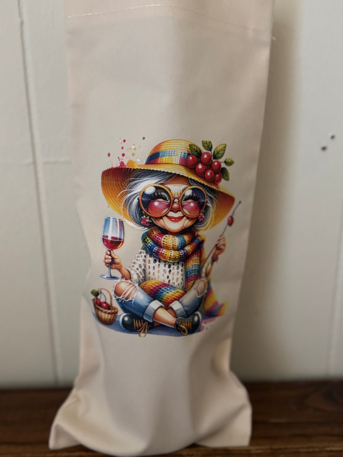 Decorative bag with a colorful illustration of a character holding a glass of wine on a white background.