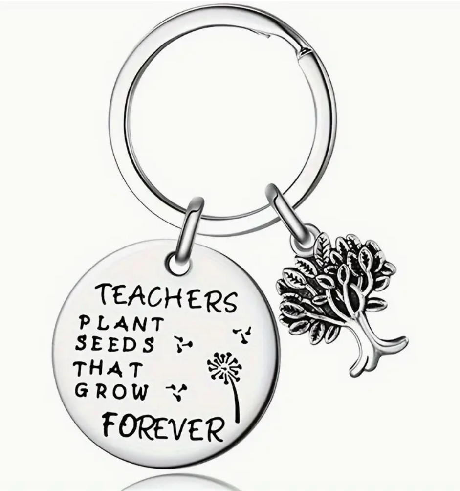 Metal keychain engraved with the phrase Teachers Plant Seeds That Grow Forever—a meaningful and lasting gift for educators.