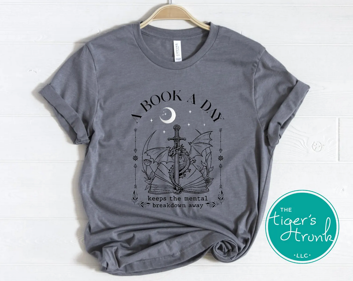Fantasy dragon t-shirt with witty reading quote, ideal for book clubs and cozy reading nights