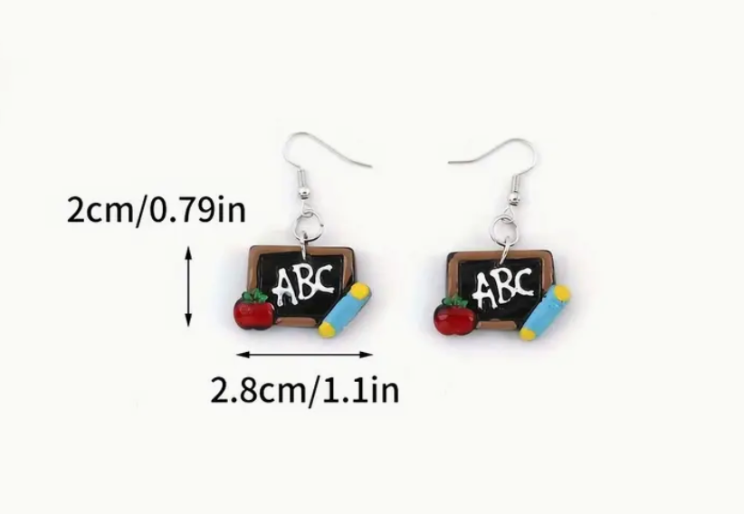 Pair of resin earrings shaped like chalkboards with the letters ABC written on them, perfect for teachers and classroom-themed outfits