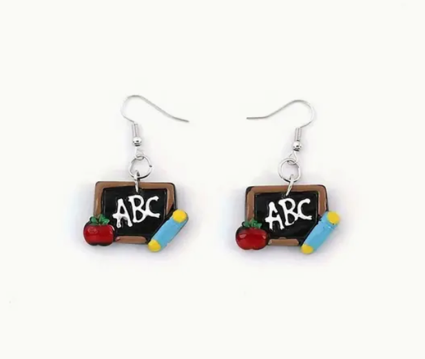 Pair of resin earrings shaped like chalkboards with the letters ABC written on them, perfect for teachers and classroom-themed outfits