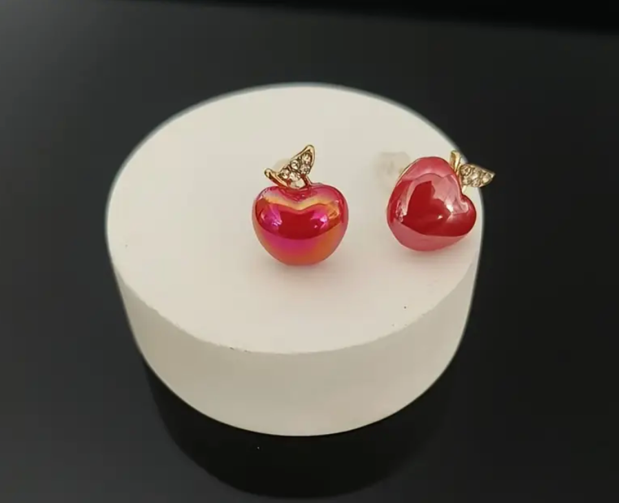 A pair of stylish apple-shaped earrings, perfect for teachers, fruit lovers, or anyone who loves unique and playful accessories.
