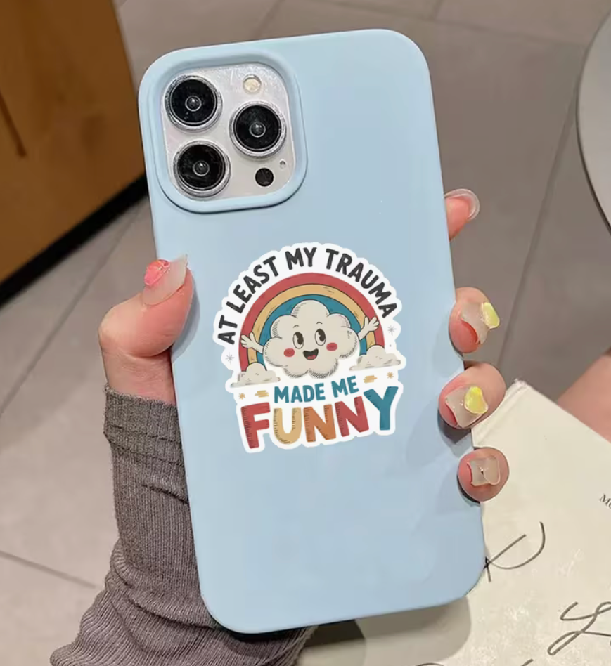 At Least My Trauma Made Me Funny 3-inch sticker with smiling cloud and retro rainbow