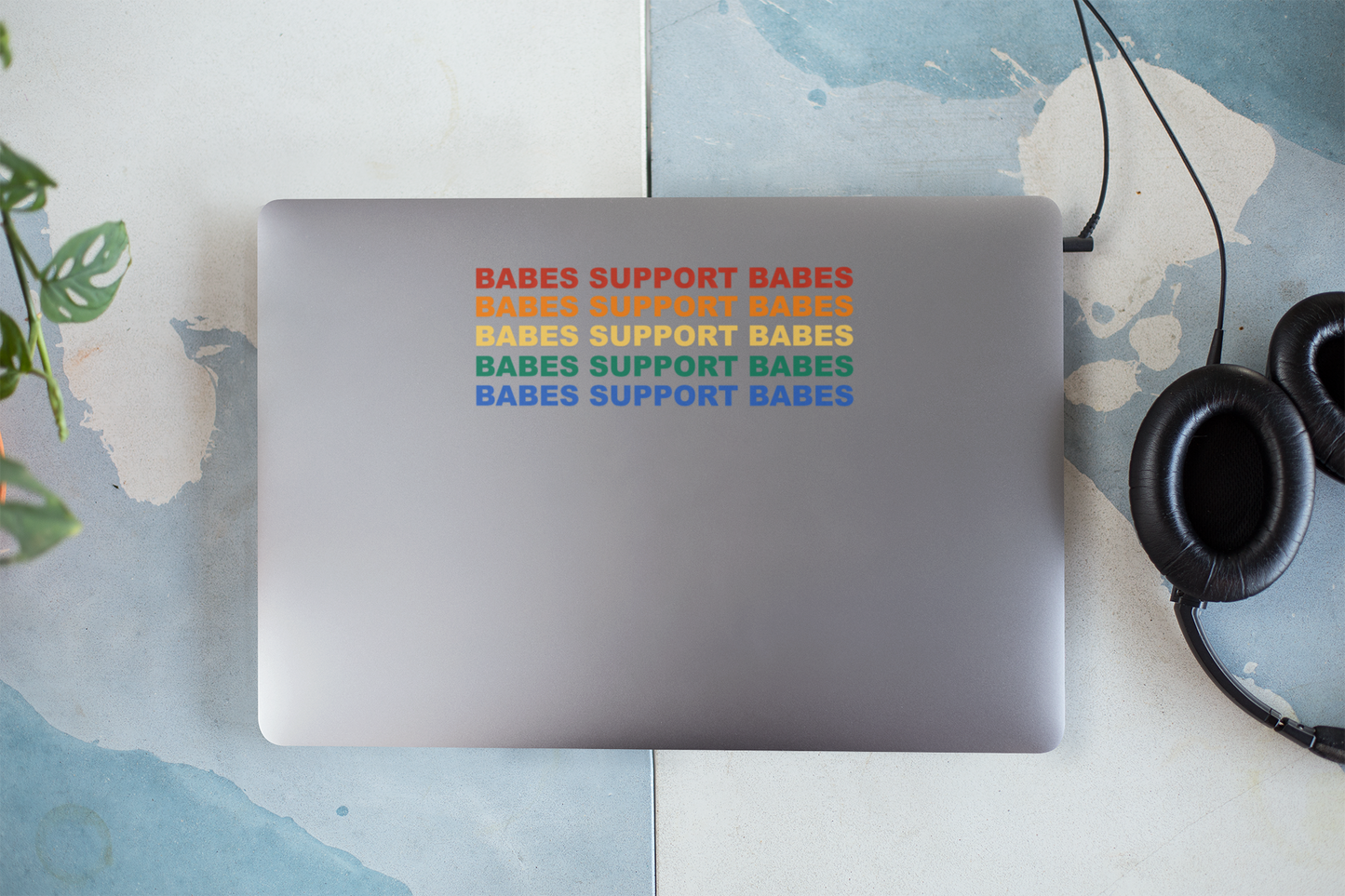 A UV-DTF sticker featuring the phrase Babes Support Babes in stylish, bold typography. Perfect for decorating water bottles, laptops, Kindles, mugs, car windows, and more.