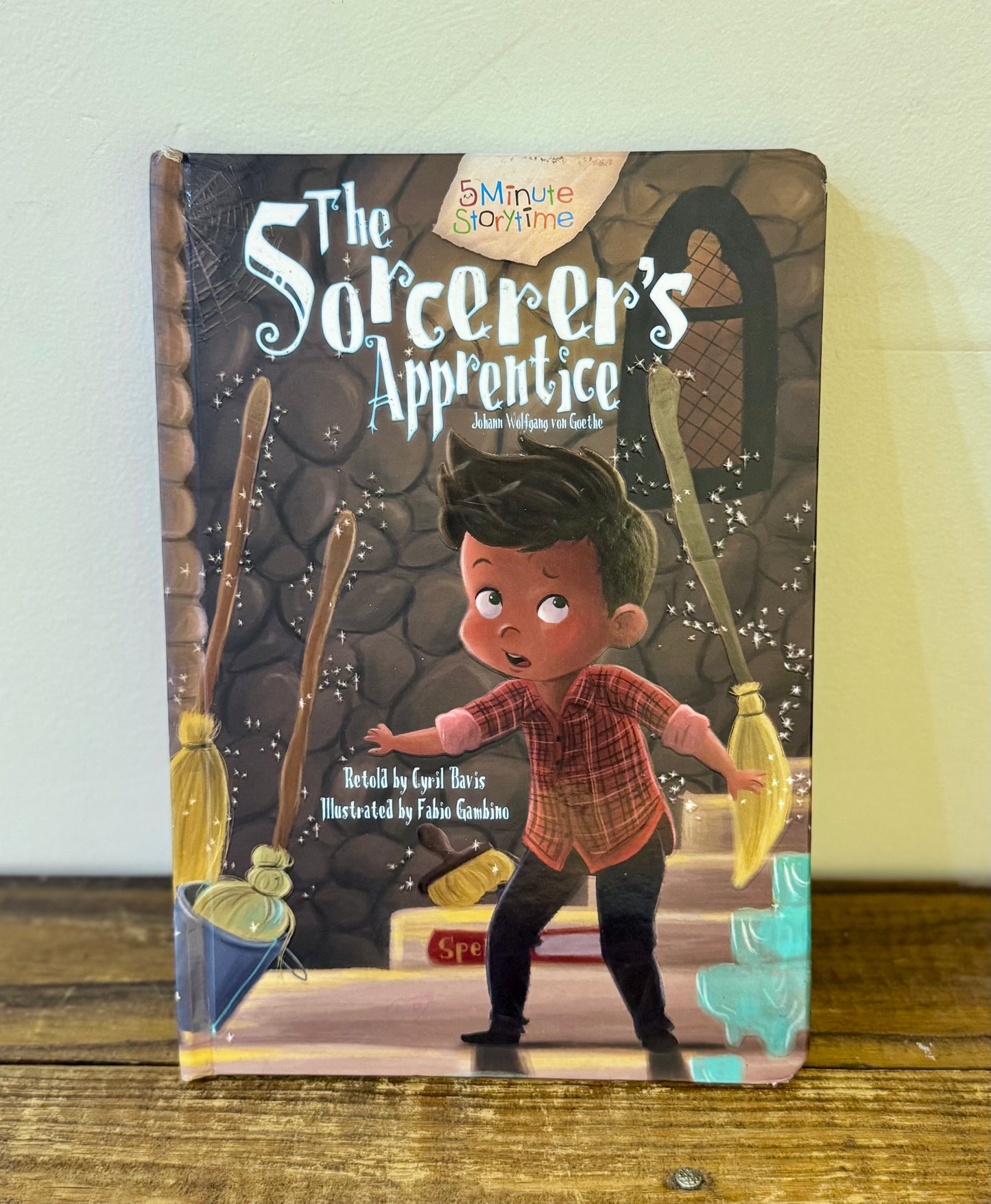 Cover of The Sorcerer's Apprentice by Cyril Bavis, featuring an illustration of a young apprentice with a magical broom.