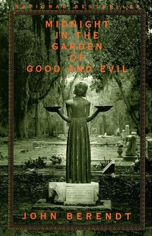 Book cover of 'Midnight in the Garden of Good and Evil' with a statue in a cemetery.