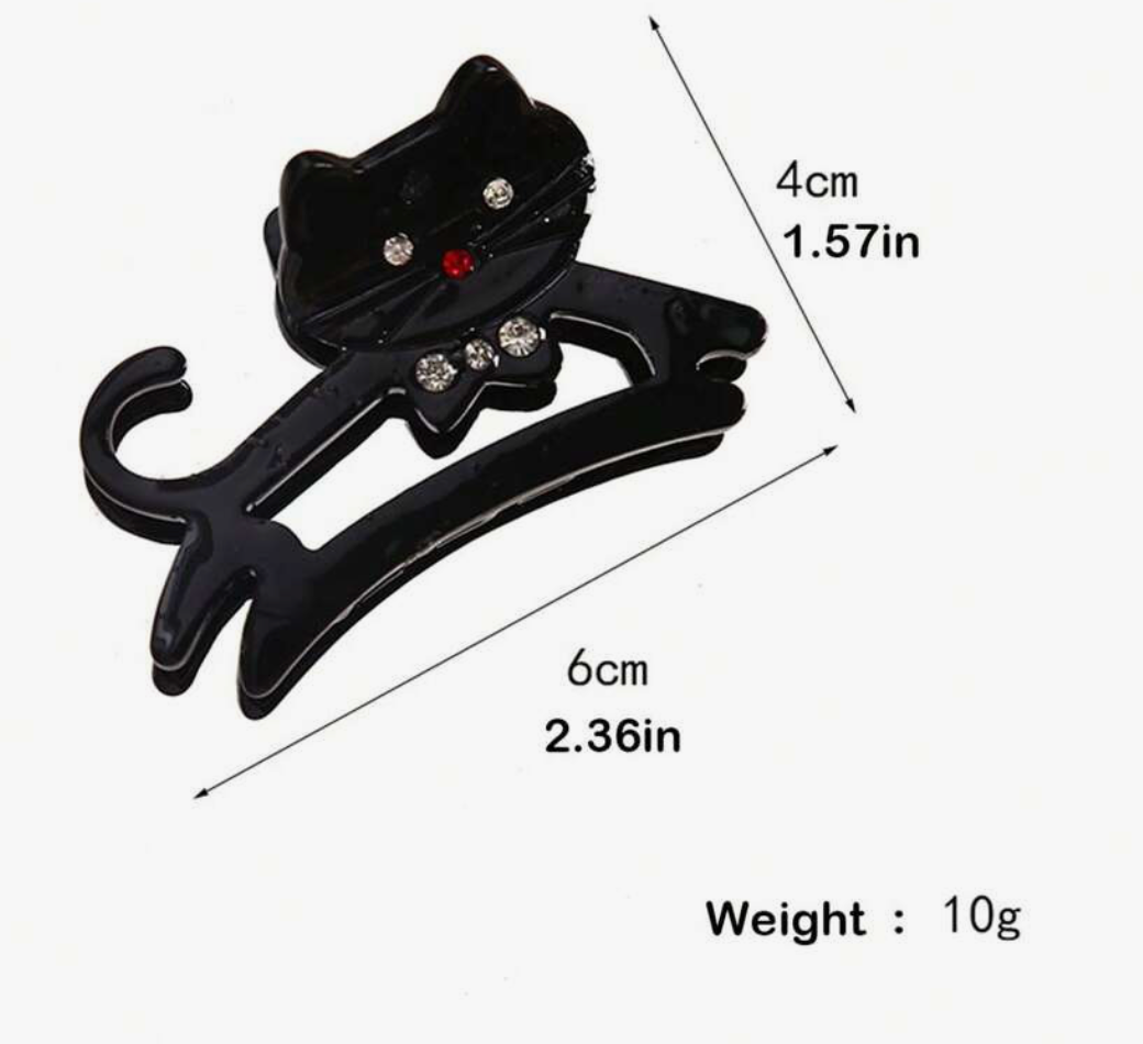 Black cat-shaped hair clip with measurements and weight on a white background