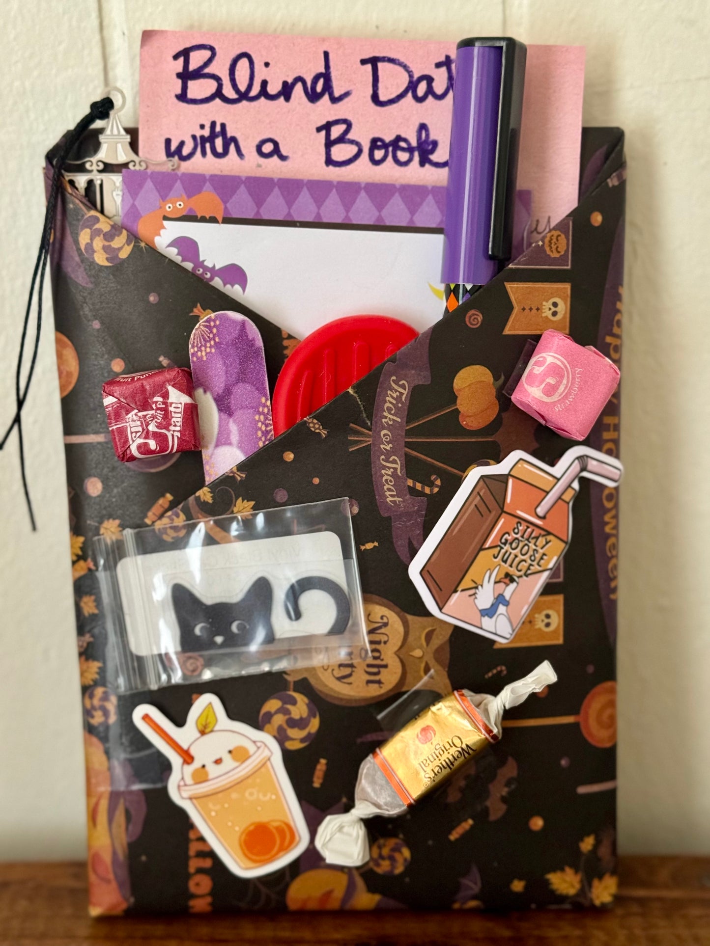 Packaged product with stickers and a book titled 'Blind Date with a Book' on a wooden surface.