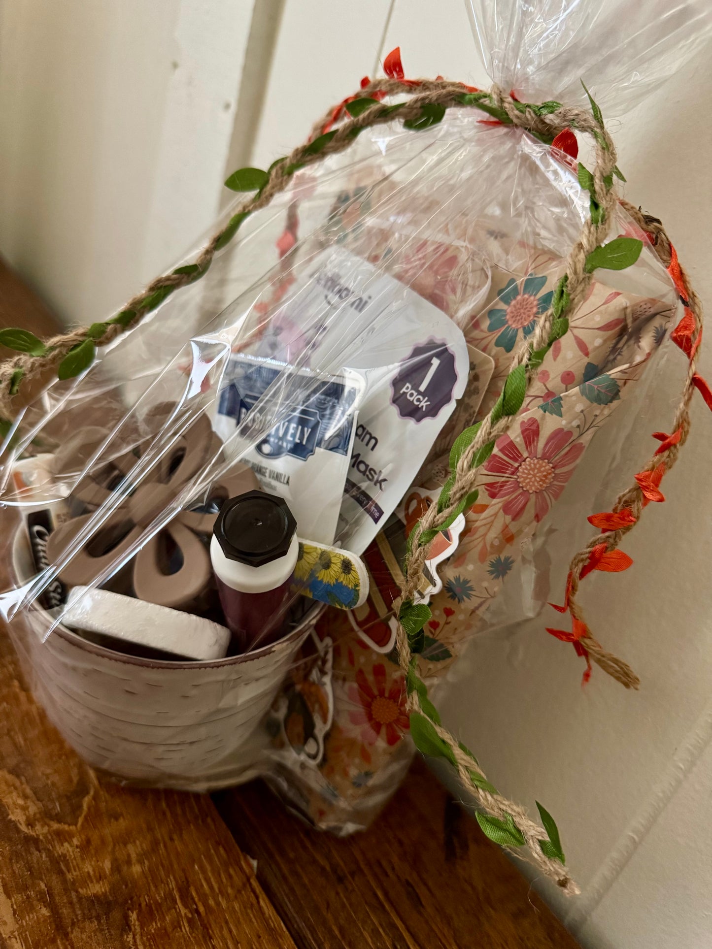 Gift basket with decorative floral pattern on a wooden surface
