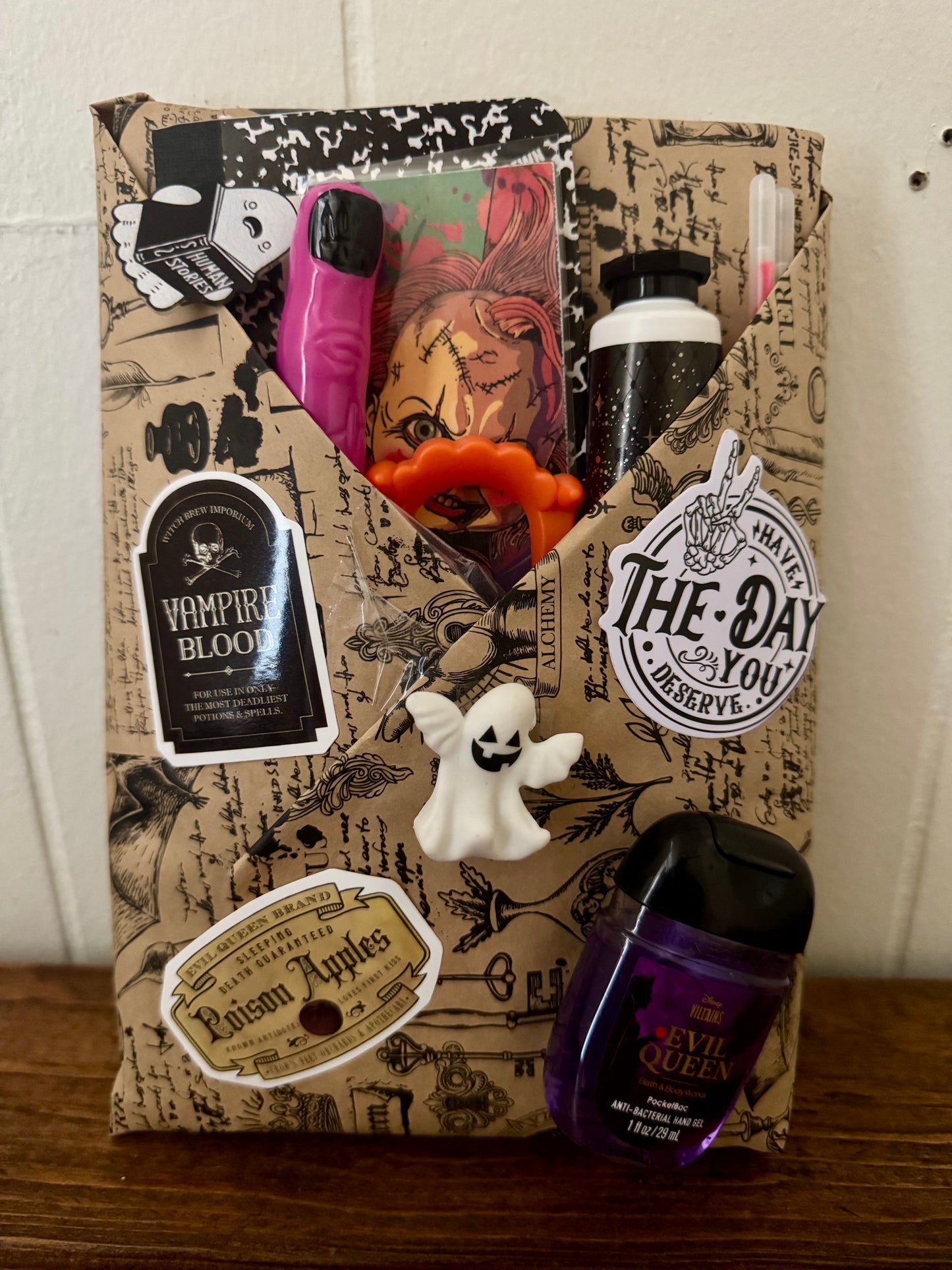 Halloween-themed gift bag with decorative elements on a wooden surface.