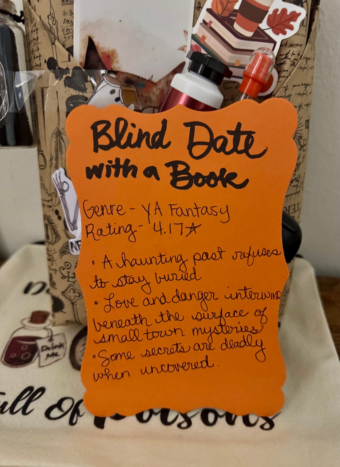 Book review card for 'Blind Date with a Book' on an orange background