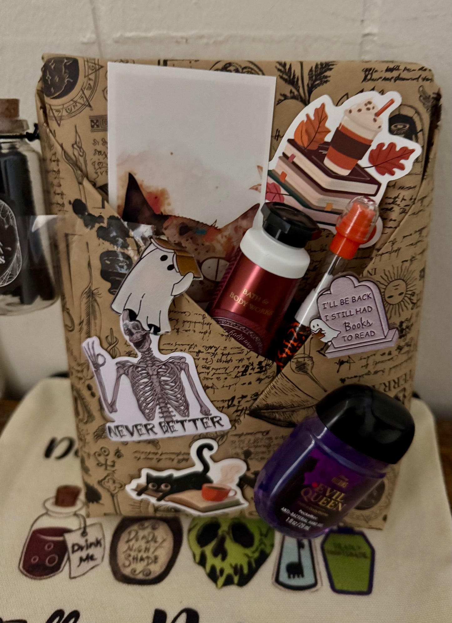 Decorative notebook with Halloween-themed stickers and a bottle of nail polish.