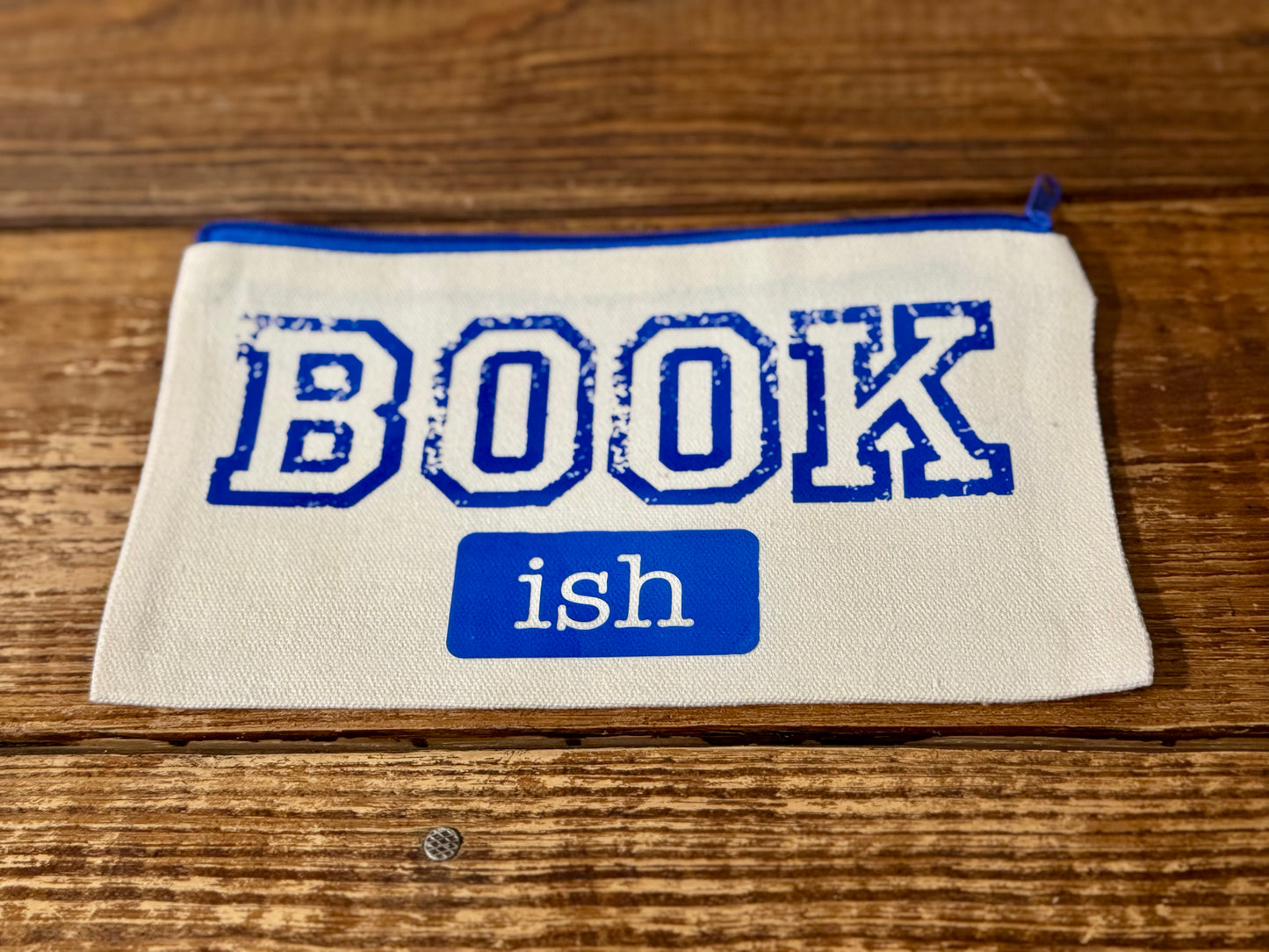 5"x8" zippered carry-all bag featuring the phrase Book-ish, perfect for storing reading accessories, small essentials, or bookish treasures.
