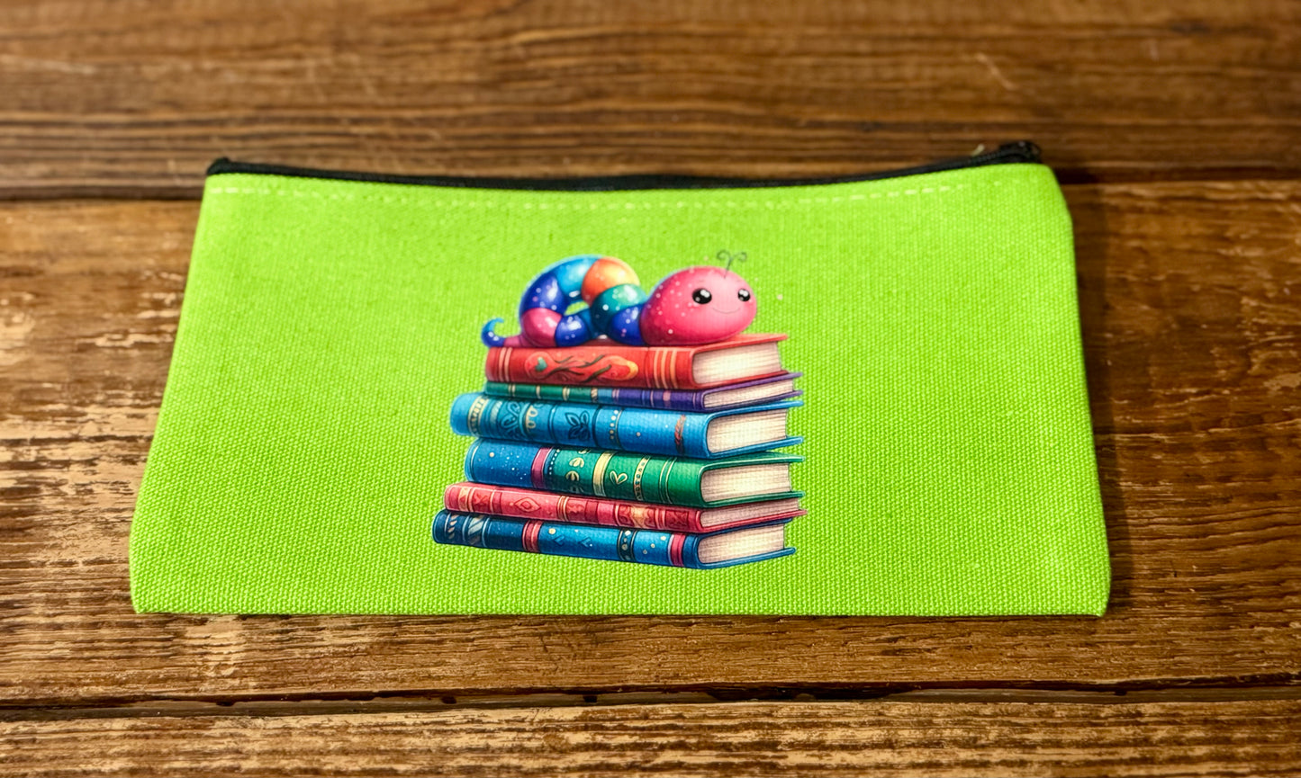Zzippered carry-all bag featuring an illustration of a stack of books with a bookworm on top, perfect for book lovers to store reading accessories and small essentials.