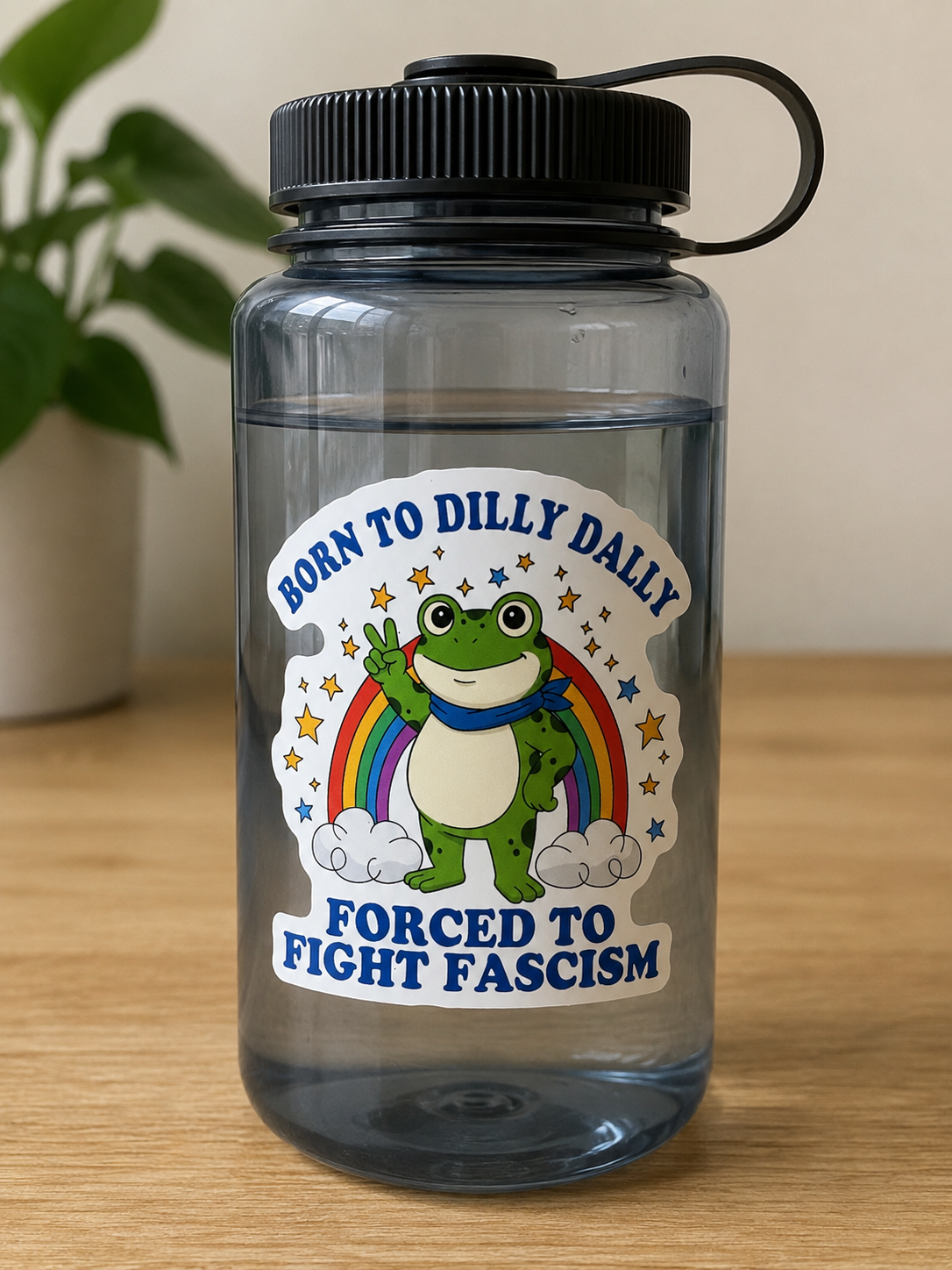 Three-inch vinyl sticker featuring a peace-sign frog with a rainbow and the phrase Born to Dilly Dally Forced to Fight Fascism.
