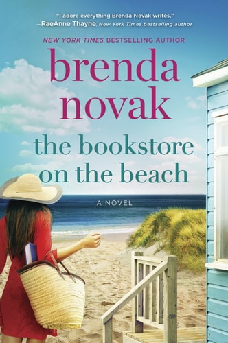 Book cover for the novel 'The Bookstore on the Beach' by Brenda Novak, featuring a beach scene with a woman in a red dress and straw hat carrying a straw tote, a light blue house, and large pink and teal title text.