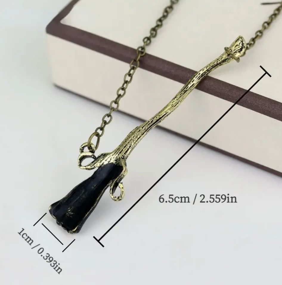 Broom Necklace, a witchy and magical jewelry piece, perfect for fantasy lovers and mystical aesthetics.
