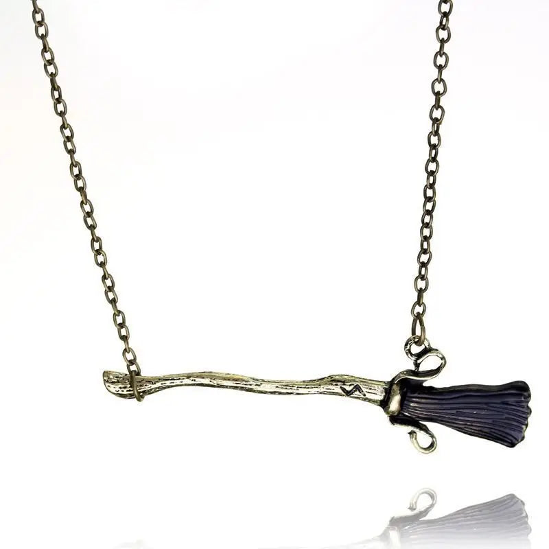 Broom Necklace, a witchy and magical jewelry piece, perfect for fantasy lovers and mystical aesthetics.