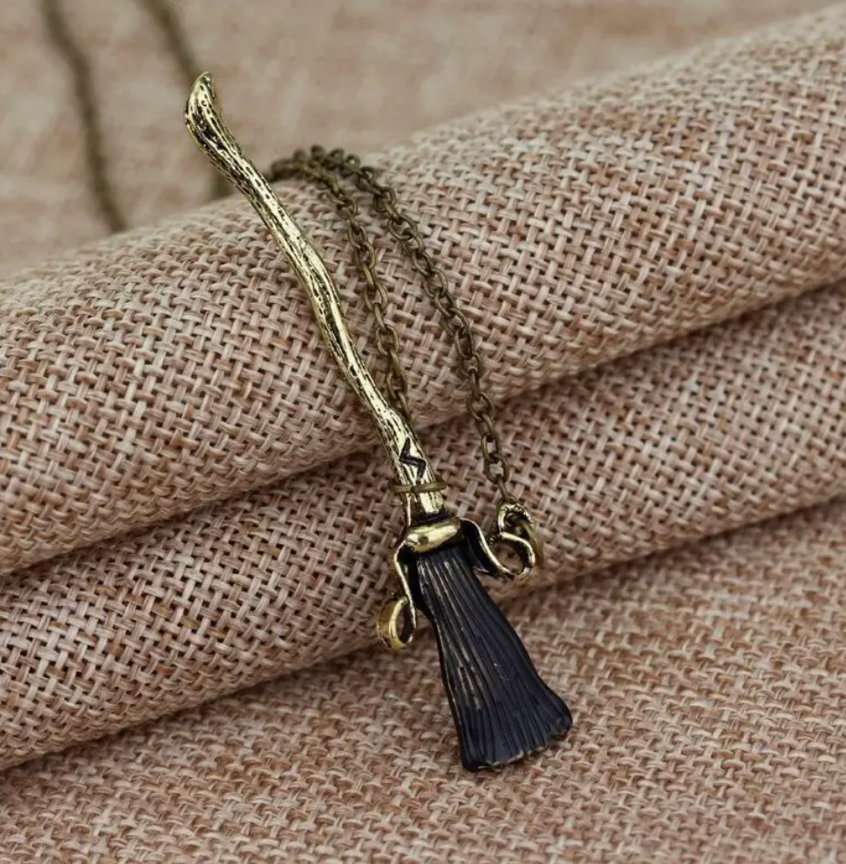 Broom Necklace, a witchy and magical jewelry piece, perfect for fantasy lovers and mystical aesthetics.