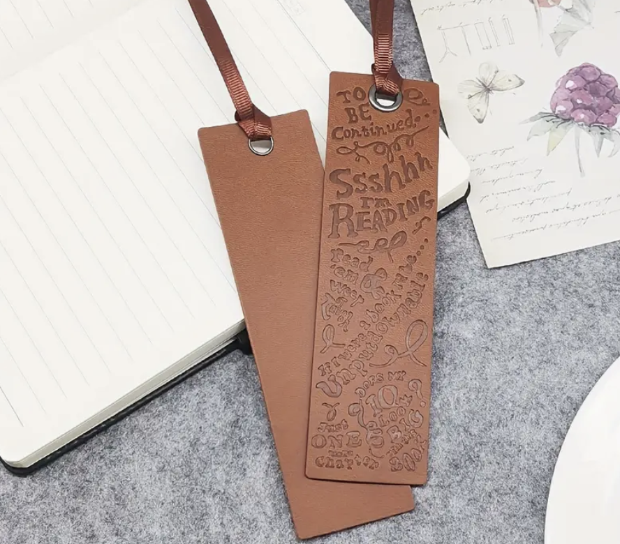 Soft and durable faux leather bookmark in a bright, colorful design—perfect for marking pages in your favorite book.