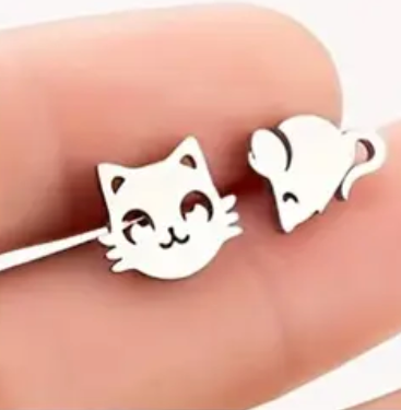Cat and mouse earrings on a hand