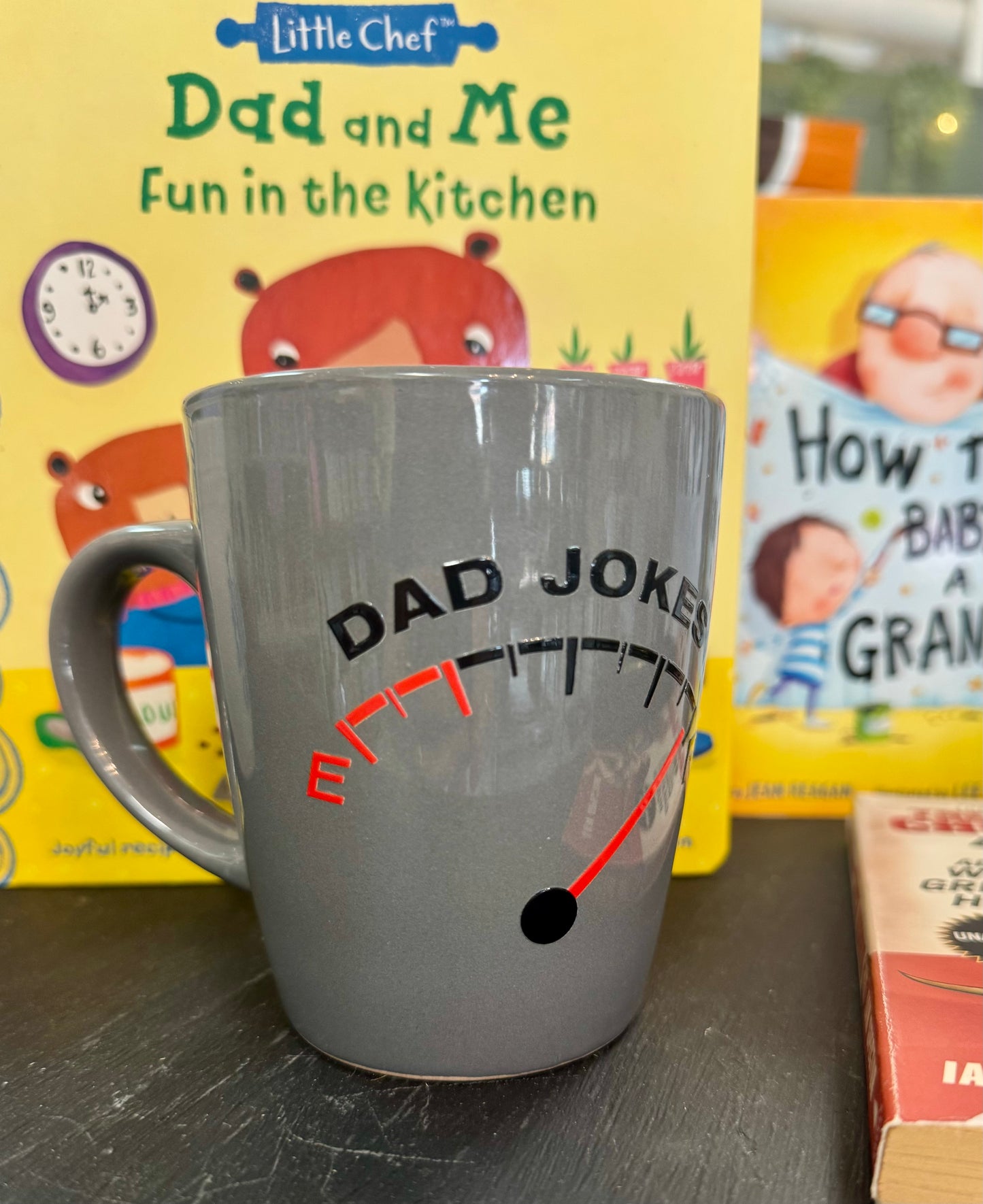 Ceramic coffee mug with the phrase Dad Jokes and a fuel gauge illustration showing Full