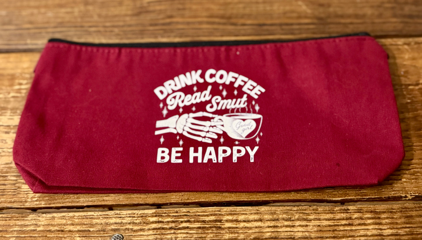 5" x 9 3/4" zippered carry-all bag featuring the phrase Drink Coffee, Read Smut, Be Happy, perfect for book lovers, romance readers, and coffee enthusiasts.