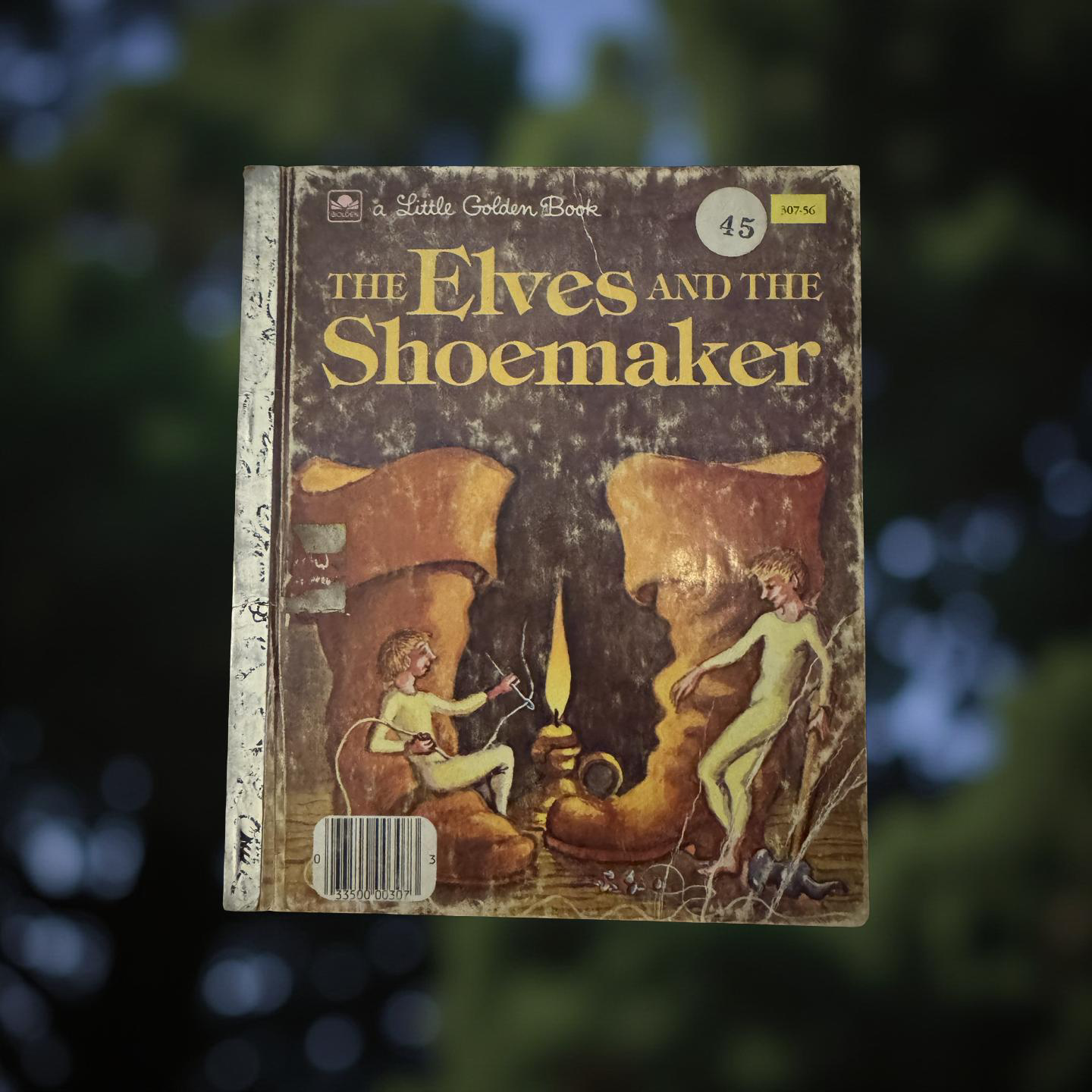 Front cover of The Elves and the Shoemaker Little Golden Book by Jim Razzi showing the shoemaker’s workshop and two helpful elves