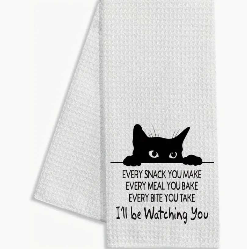 White towel with black cat design and text on a white background