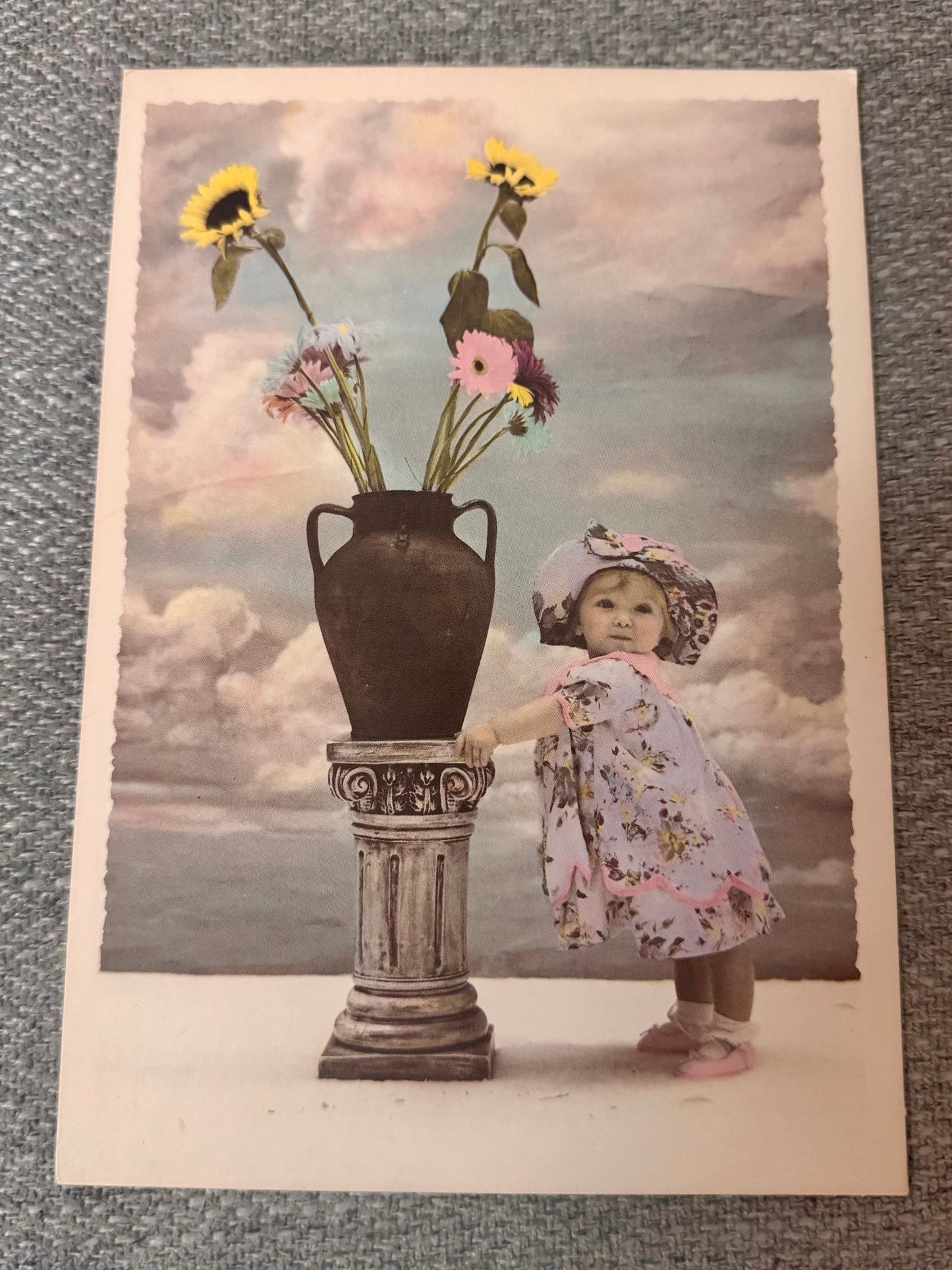 A sweet and charming Just Because greeting card featuring an illustration of a little girl holding a flower vase, perfect for any occasion.