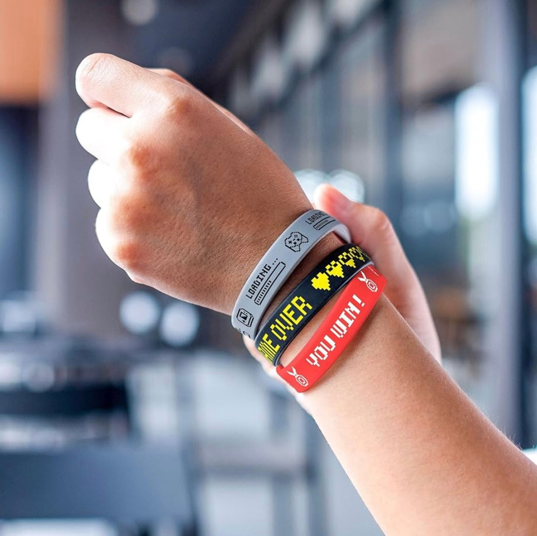 A set of colorful silicone bracelets featuring video game-themed designs, perfect for gamers, party favors, and everyday wear.