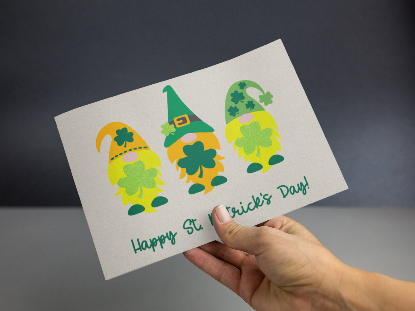 A festive St. Patrick’s Day greeting card featuring charming gnomes in green attire, perfect for spreading holiday cheer.
