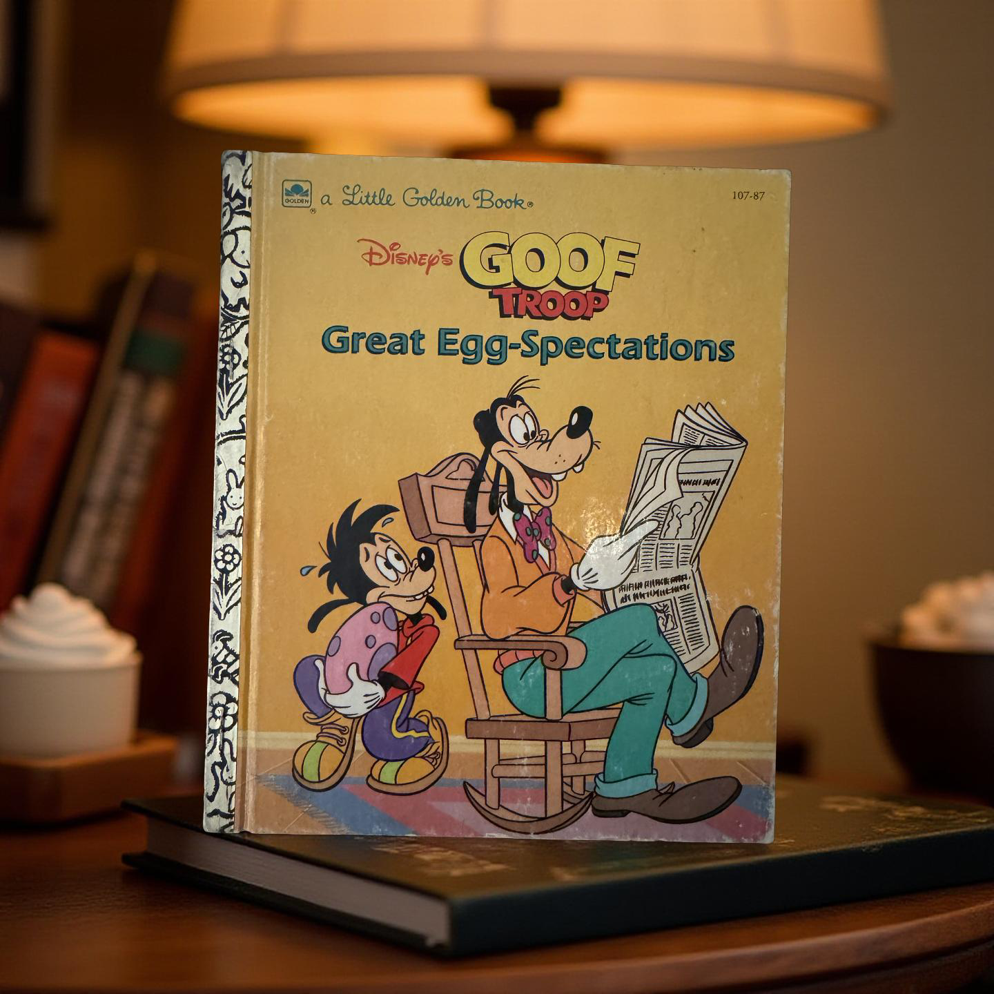 Front cover of Goof Troop Great Egg-Spectations Little Golden Book by Michael Teitelbaum featuring Goofy and Max in an Easter egg adventure