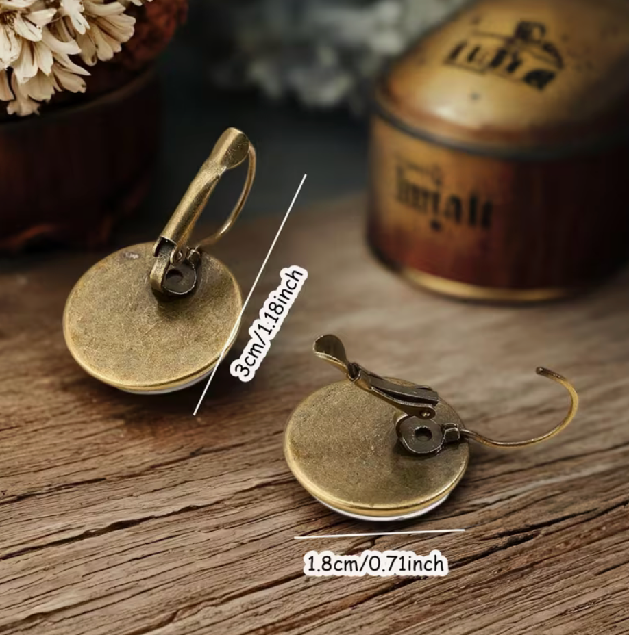 Back and size view of gothic raven earrings measuring approximately 1.18 inches long with 0.71 inch round pendants