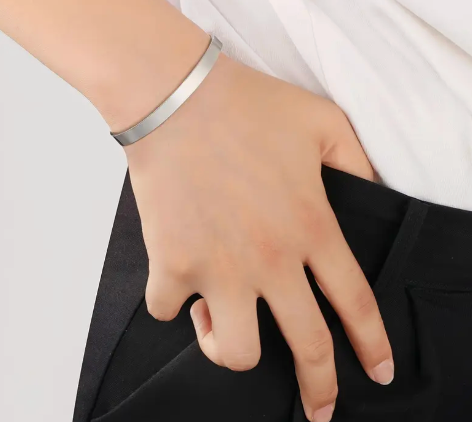 Stainless steel graduation bracelet with a graduation cap and 2025 engraved on the outside, and an inspirational quote inside for the Class of 2025.