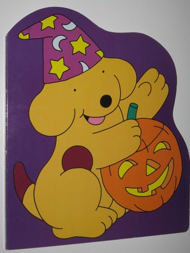 Cartoon dog in a witch hat with a Halloween pumpkin on a purple background
