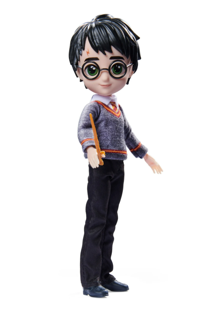 A Harry Potter doll from the Wizarding World collection, dressed in a Hogwarts uniform with a wand in hand. Perfect for collectors and fans of the series.