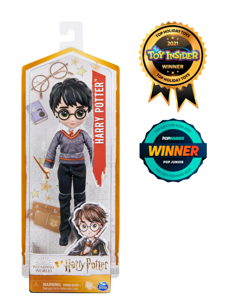 A Harry Potter doll from the Wizarding World collection, dressed in a Hogwarts uniform with a wand in hand. Perfect for collectors and fans of the series.