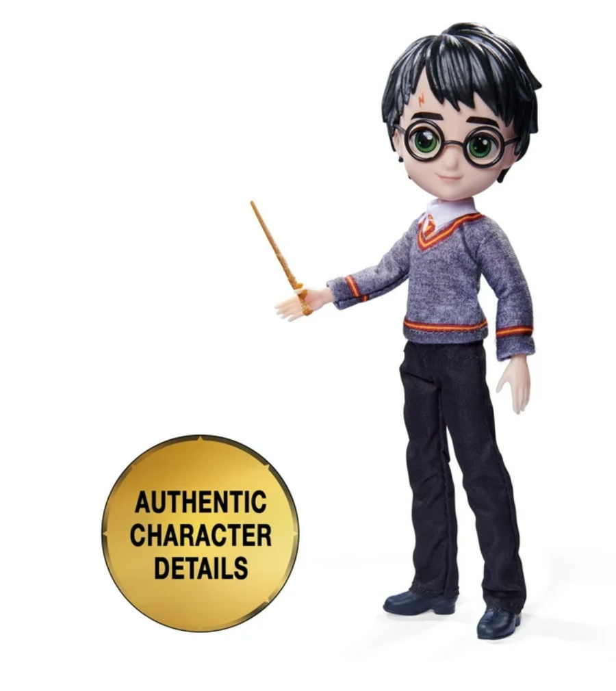 A Harry Potter doll from the Wizarding World collection, dressed in a Hogwarts uniform with a wand in hand. Perfect for collectors and fans of the series.